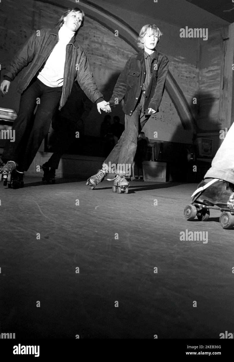 Roller skate fun in the 1960s. Interior of a roller disco with people