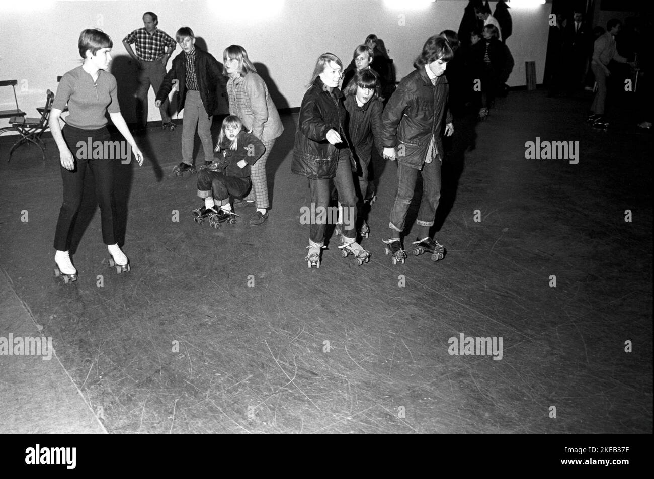 Roller skate fun in the 1960s. Interior of a roller disco with people