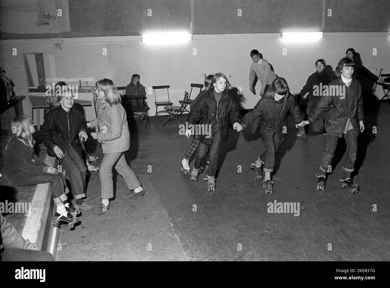 Roller skate fun in the 1960s. Interior of a roller disco with people