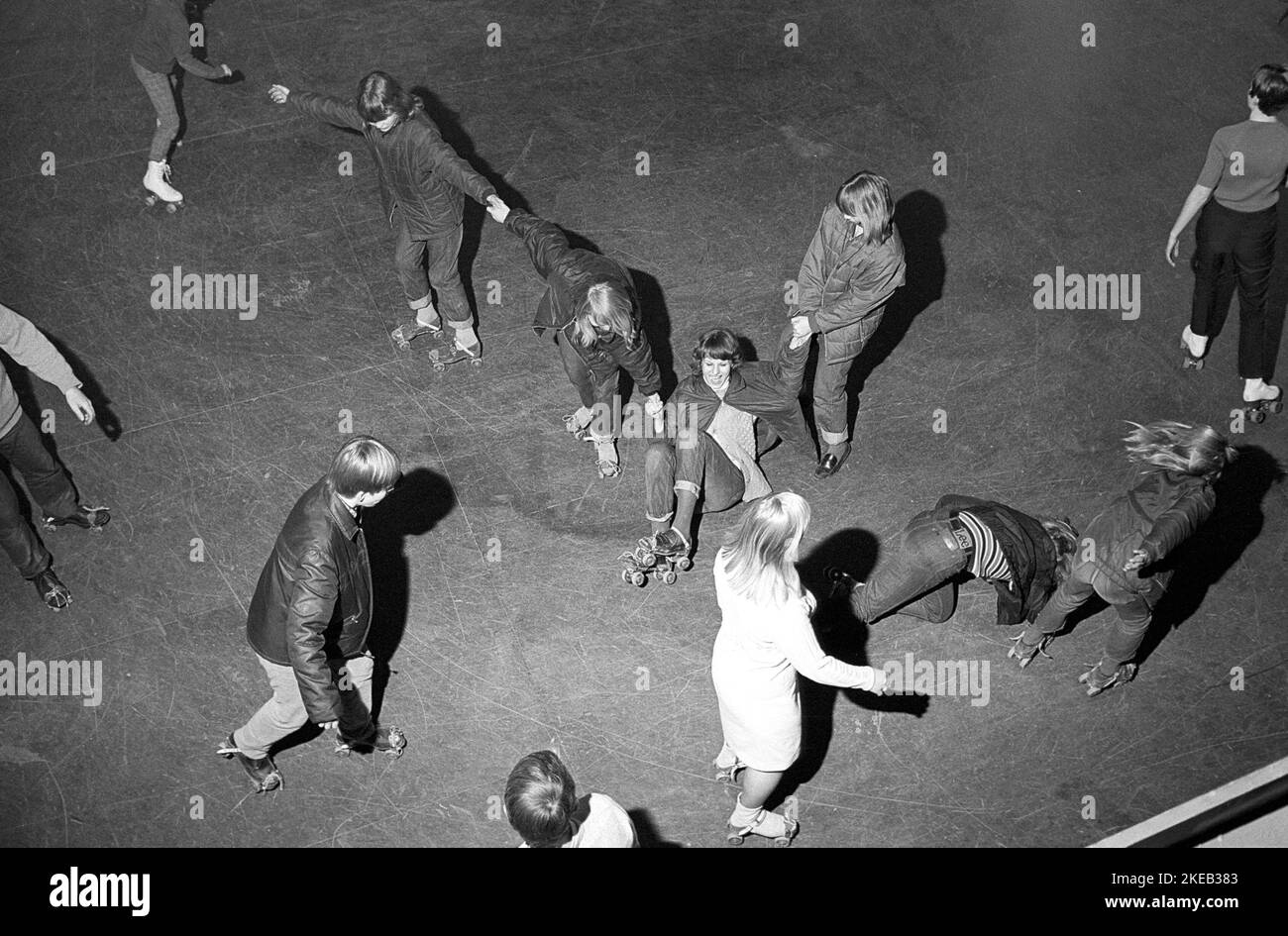 Roller skate fun in the 1960s. Interior of a roller disco with people