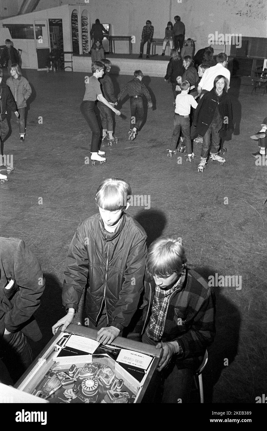 Roller skate fun in the 1960s. Interior of a roller disco with people