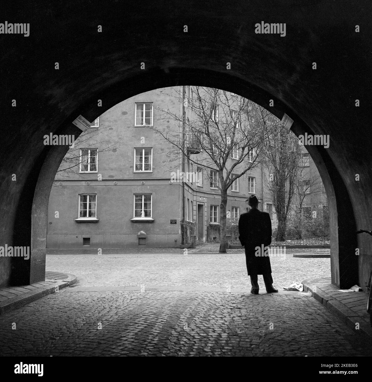 In the 1950s.  A man in full figure stands in the street at the edge of a tunnel. Stockholm Sweden 1950.  Conard ref 1496 Stock Photo