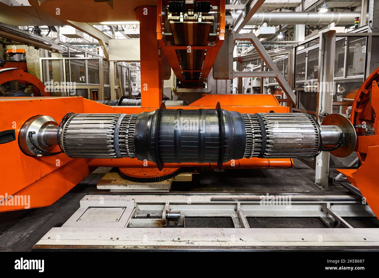 Metal shaft with rubber layers and equipment to form tire Stock Photo