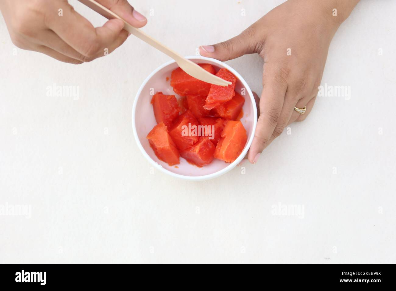 top view of women eating eater melon  Stock Photo