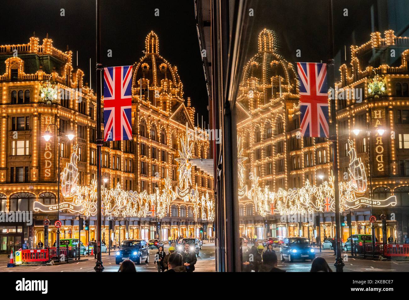 London, UK. 10th Nov, 2022. Christmas lights on Harrods facade appear to be a giant advert for