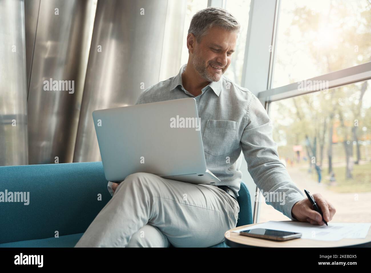 Seated comfortably on sofa happy hi-res stock photography and images ...