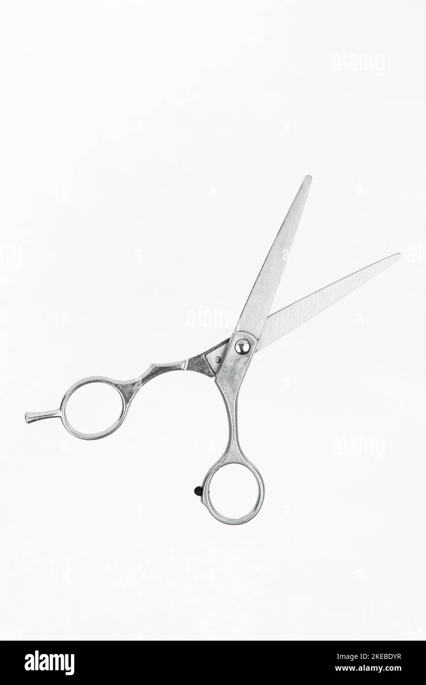 Professional flying scissors for haircuts on white background