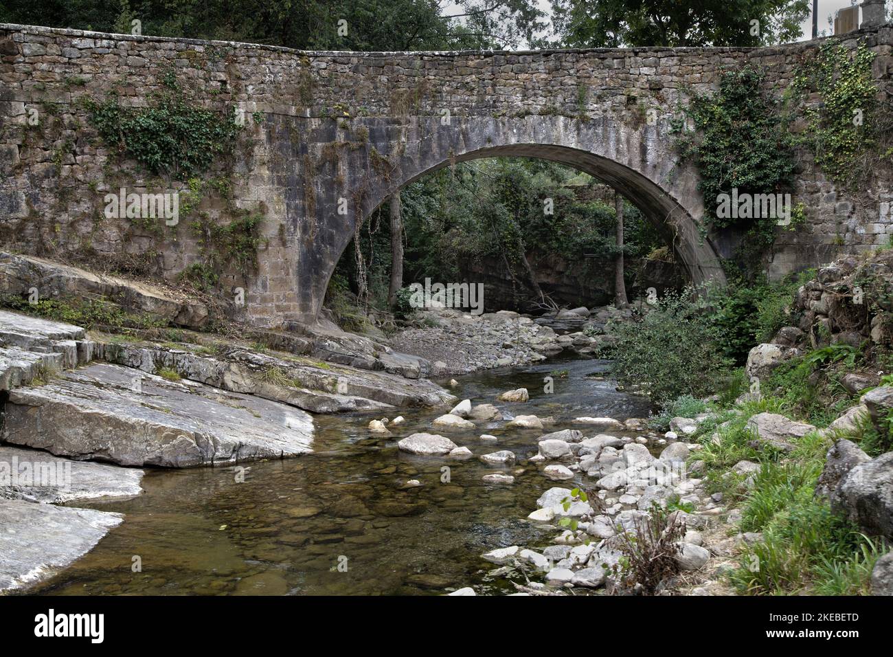 Stone bridge over the river Argoza in Barcena Mayor, Cantabria, Spain. Stock Photo