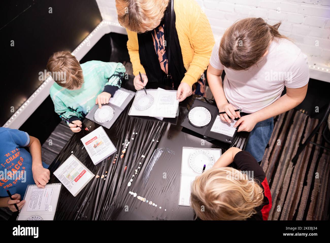 Kids Using Pen Children write with a felt tip pen on a disk hi-res stock photography ...
