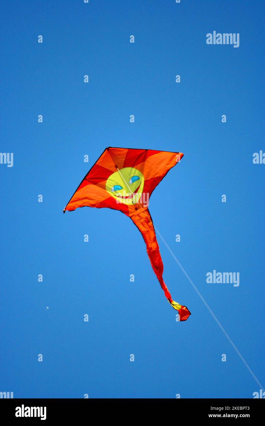 Smily face orange kite Stock Photo
