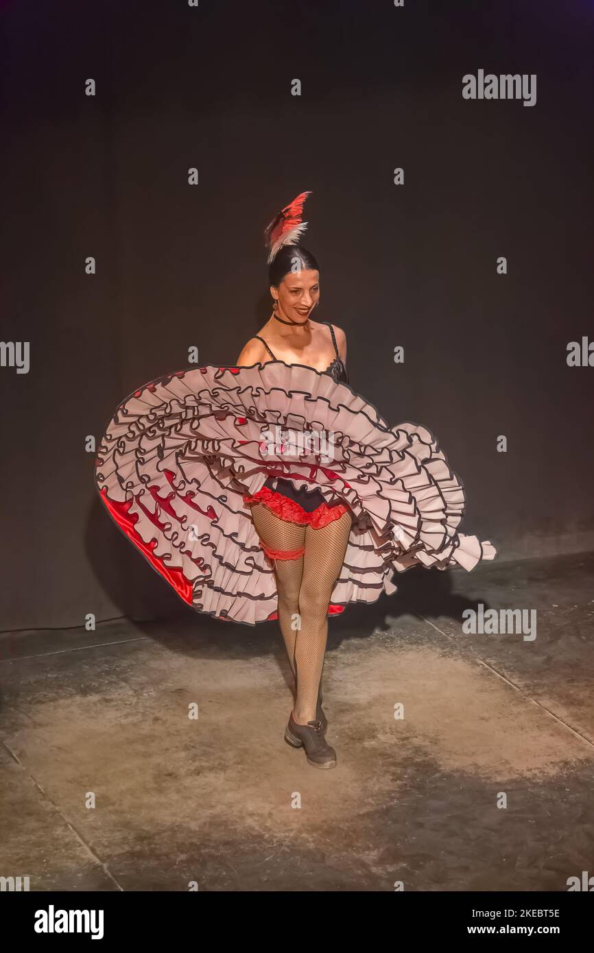 https://c8.alamy.com/comp/2KEBT5E/almria-spain-09-15-2021-view-of-can-can-dance-live-show-recreating-old-american-west-saloon-dancer-dressed-in-typical-burlesque-cabaret-robes-o-2KEBT5E.jpg