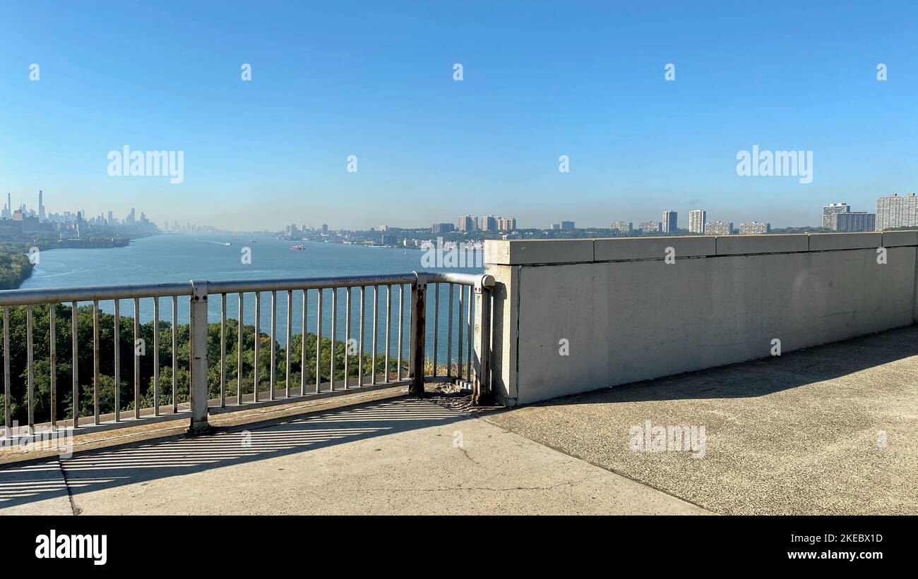 New York, NY, USA - Nov 11, 2022: Looking south from a pedestrian walkway on the George Washington Bridge towards an overcast view of NYC and New Jers Stock Photo