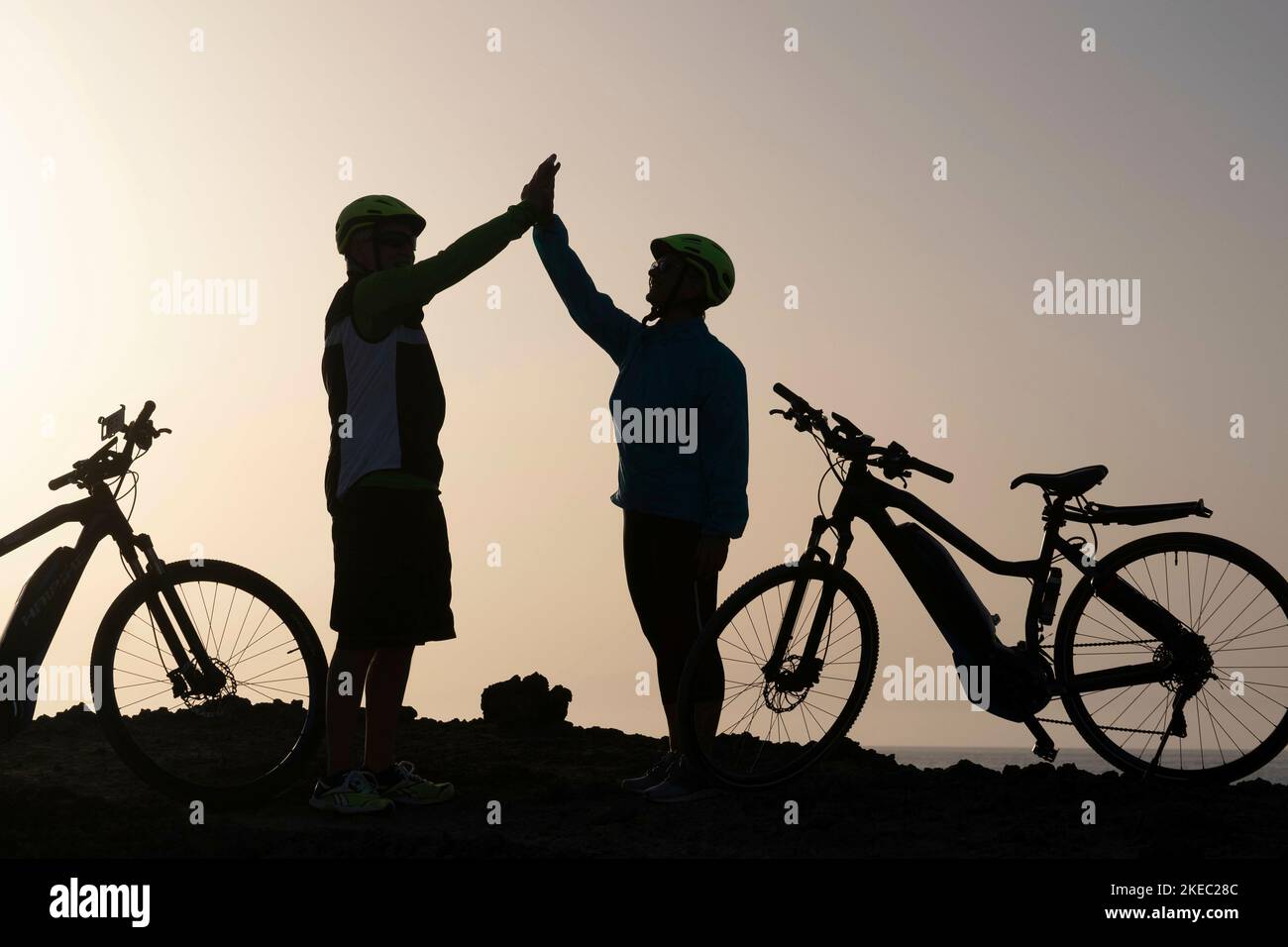couple of two seniors together giving five and training to be healthy and fitess lifestyle - active mature people Stock Photo