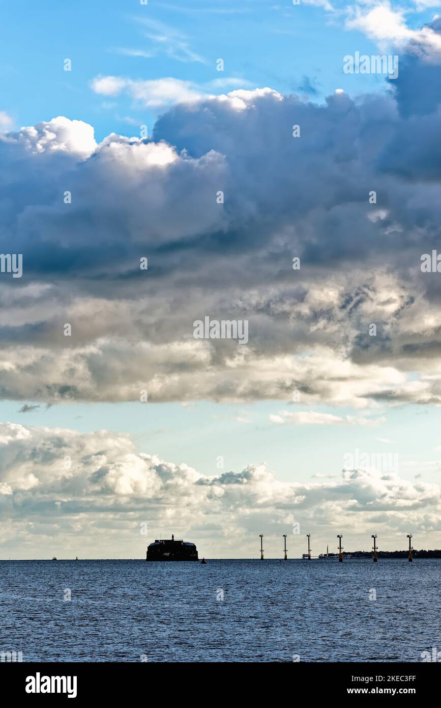 Spitbank fort  on the horizon of Spithead in the Solent viewed from Portsmouth on an autumn evening Hampshire England UK Stock Photo