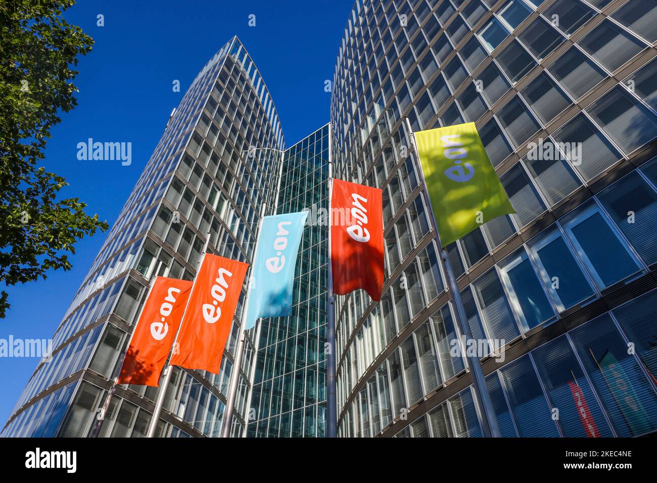 Essen, North Rhine-Westphalia, Germany - E.ON headquarters. e.on company logos on flags in front of the headquarters. Stock Photo