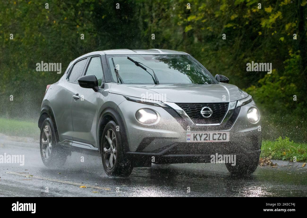 2021 silver Nissan Juke N-CONNECTA DIG-T S-A  driving in the rain on a wet road Stock Photo