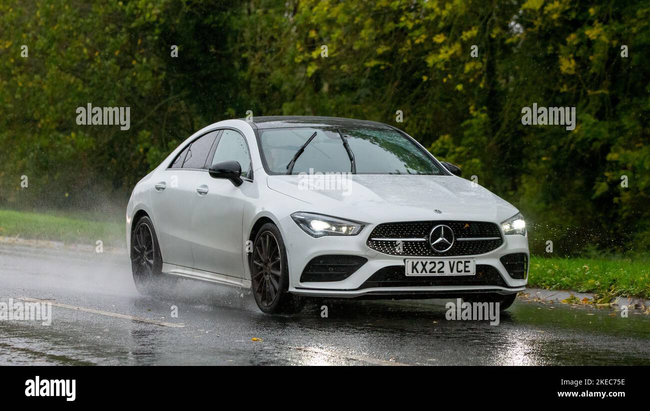 2022 white diesel engine Mercedes Benz CLA 220 AMG LN PRM+ NGT ED D A  driving in the rain on a wet road Stock Photo