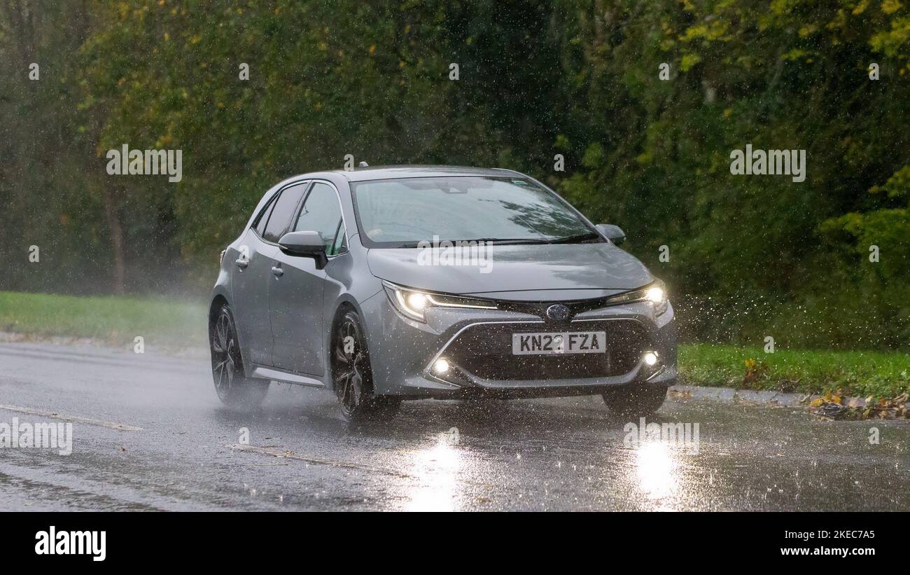 2022 toyota corolla excel hev cvt hybrid electric car driving in the