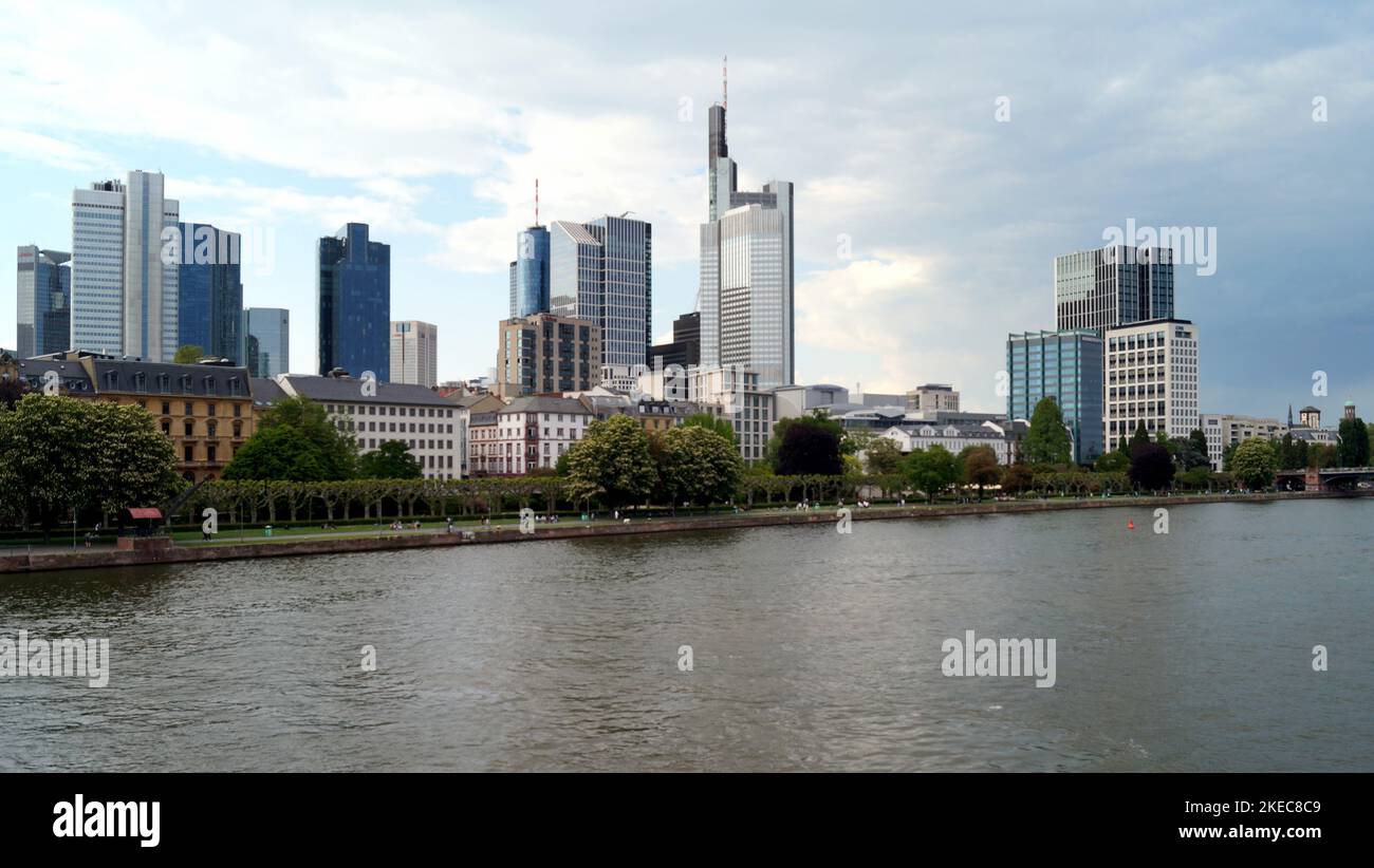 View upstream of river Main, with skyline of modern skyscrapers of the right bank, Frankfurt, Germany Stock Photo