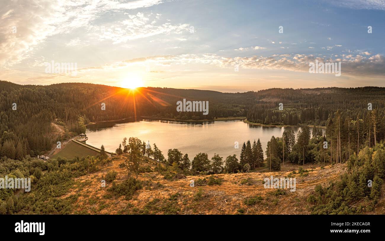 Germany, Thuringia, Neuhaus am Rennweg, Scheibe-Alsbach, reservoir, dam, forest, mountains, sunrise, back light Stock Photo