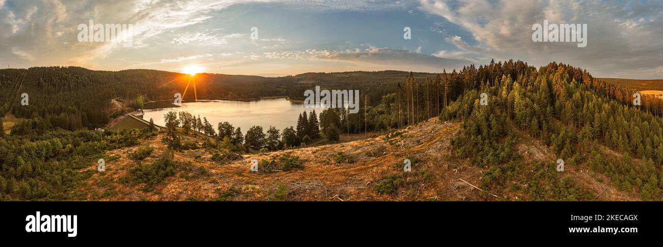 Germany, Thuringia, Neuhaus am Rennweg, Scheibe-Alsbach, reservoir, dam, forest, mountains, sunrise, backlight, panorama photo Stock Photo