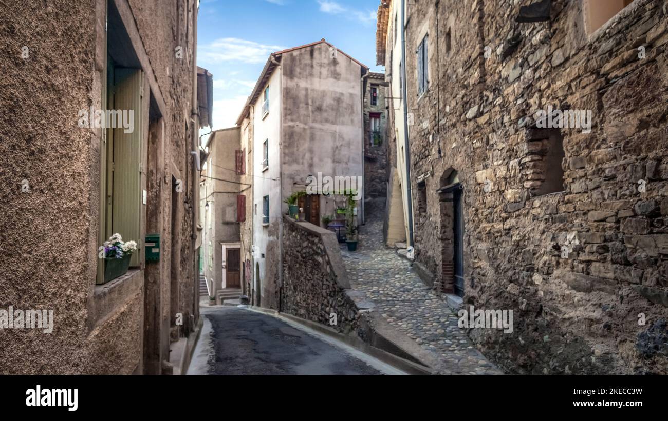 Village street in Roquebrun. The commune is located in the Regional Natural Park of Haut-Languedoc. Stock Photo