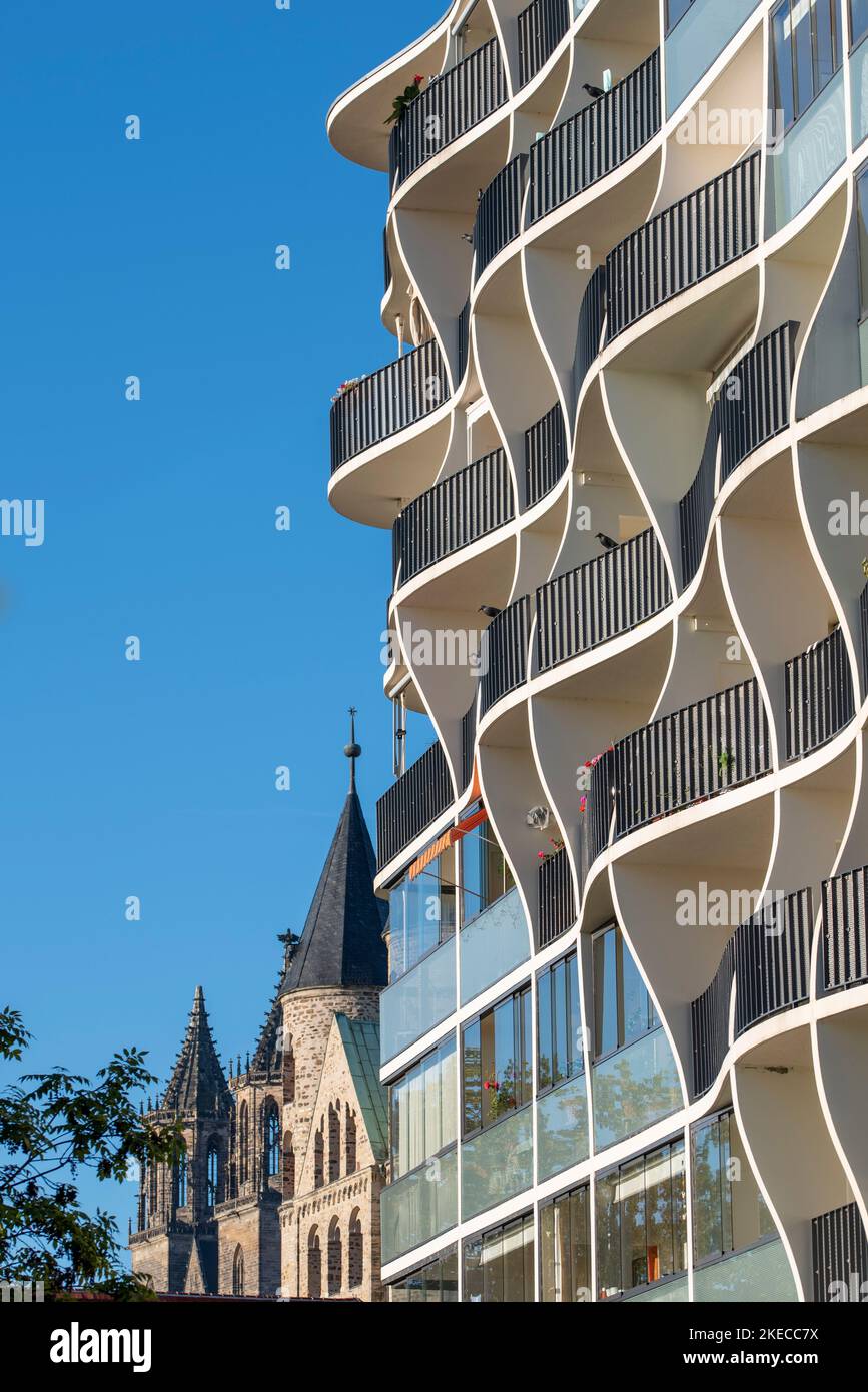 Magdeburg Cathedral can be seen next to a modern residential building