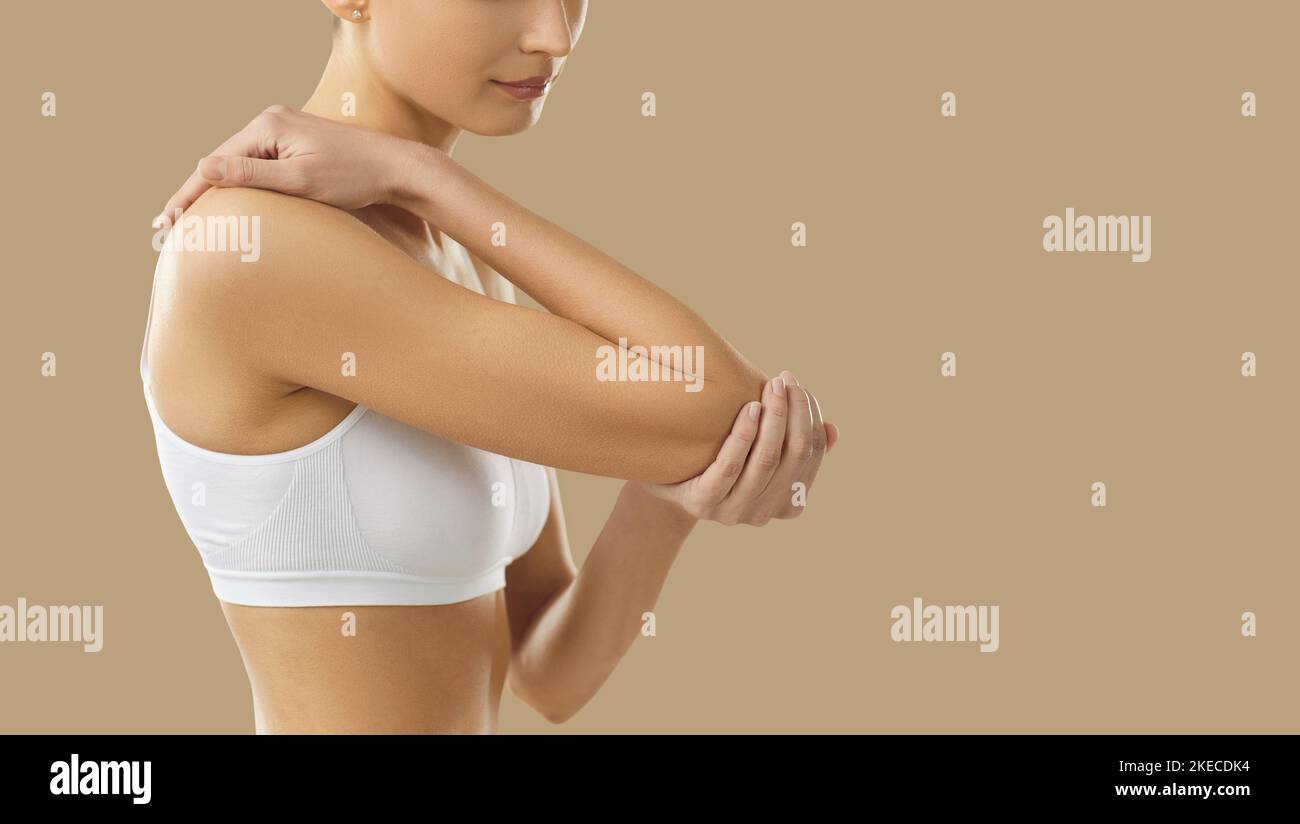 Woman touch elbow suffer from acute pain Stock Photo