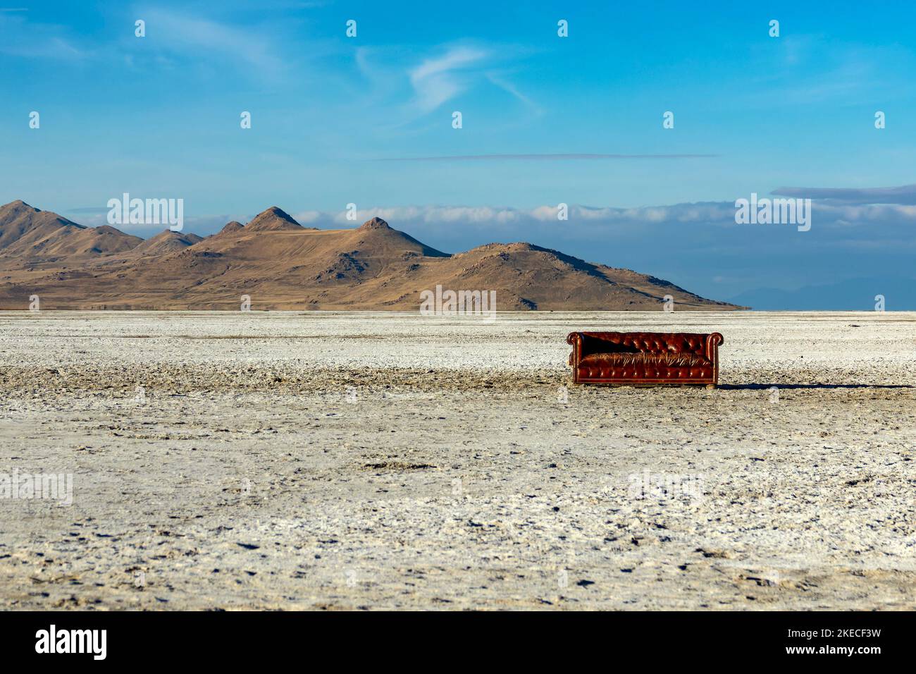 Sofa at the Great Salt Lake. In the background Antelope Island. Stock Photo