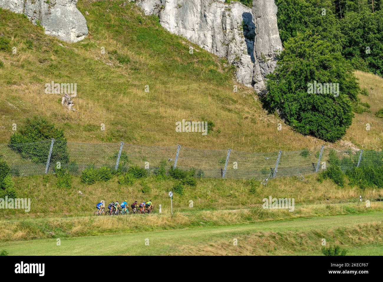Cycling group, rock group 'Spitziger Stein' in the Great Lauter Valley in the Swabian Alb. Stock Photo
