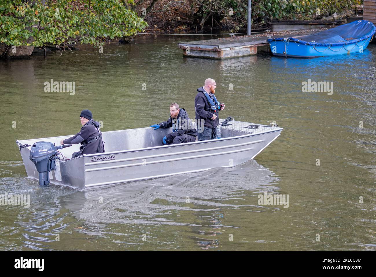 Boat containing three Environment Agency officers checking for pollution on the River Avon, Stratford upon Avon, Warwickshire, UK on 8 November 2022 Stock Photo