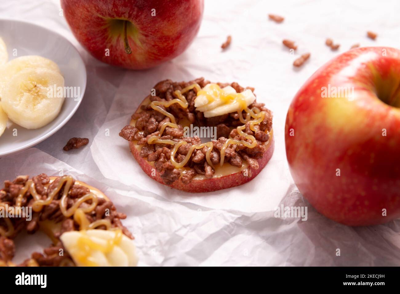 Creative party snack for holidays. Apple rounds with peanut butter