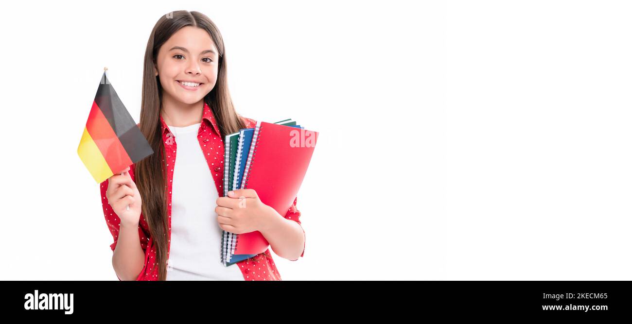 learn foreign language. happy teen girl hold german flag and workbook