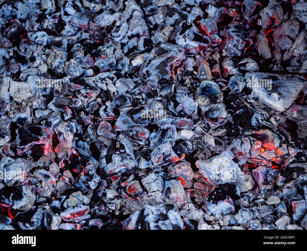 Smoldering embers in the fireplace are evenly coated Stock Photo Alamy