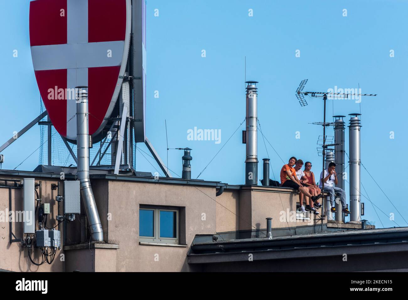 Vienna, young people on roof of high-rise apartment house, coat of arms of the city of Vienna in 22. Donaustadt, Wien, Austria Stock Photo