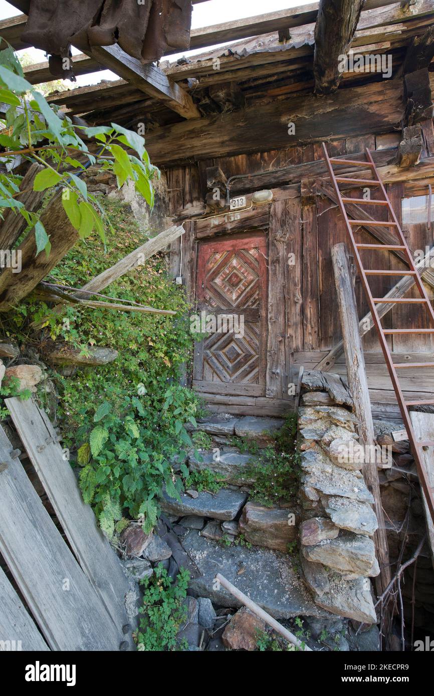 Front door of an abandoned mountain farm in South Tyrol Ulten Valley Stock Photo