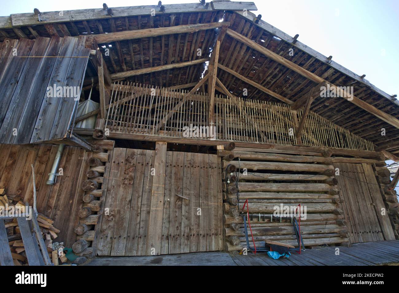 Front, in wooden beam construction, of an old large barn in the South Tyrolean Ulten Valley Stock Photo