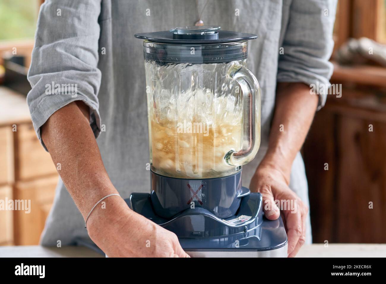 Steps for the preparation of almond milk, mass is ground in the blender