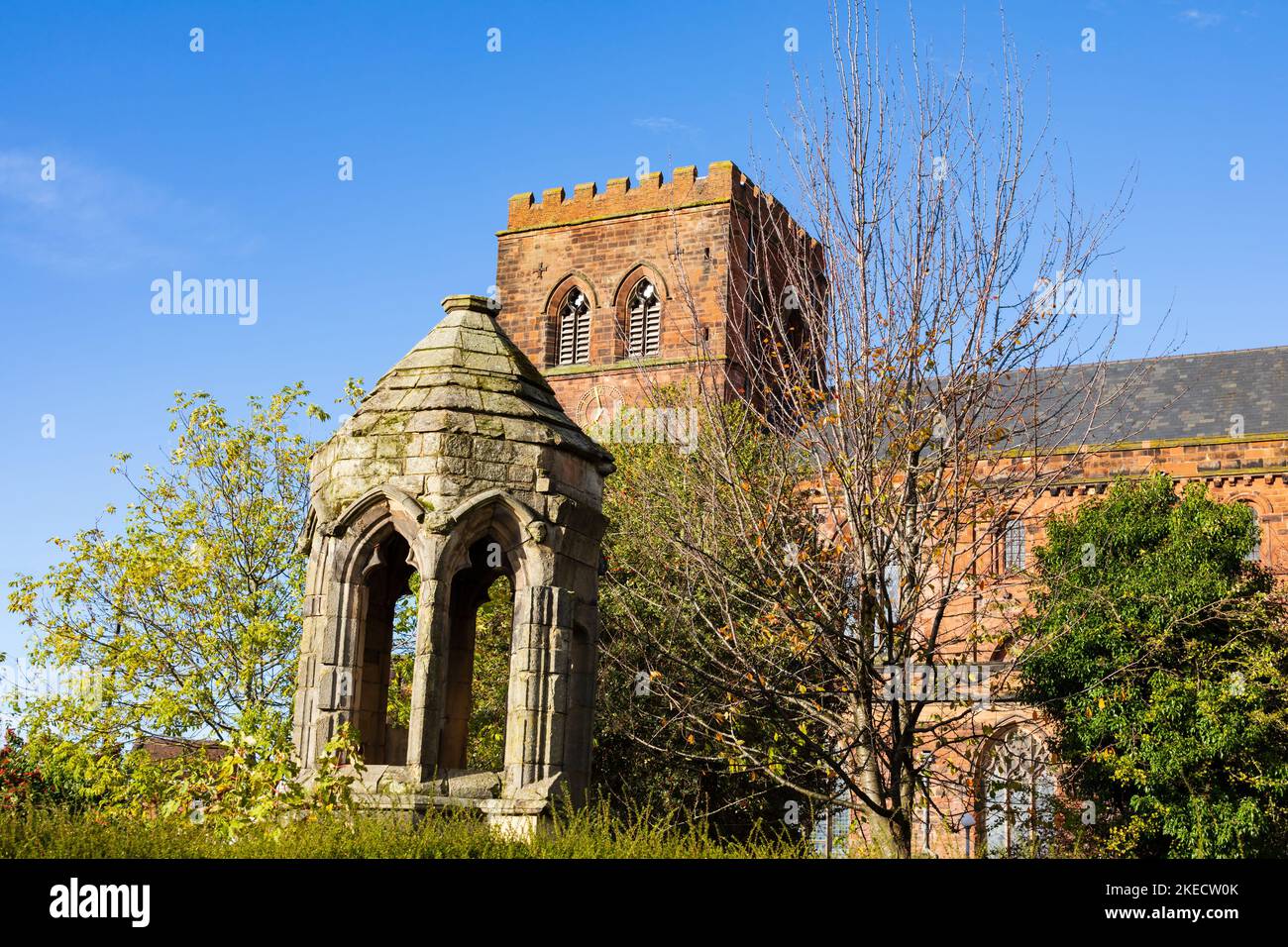 The original 1300 carved pulpit in front of The Abbey church of St Peter and St Paul,  Shrewsbury, Shropshire, England. Stock Photo