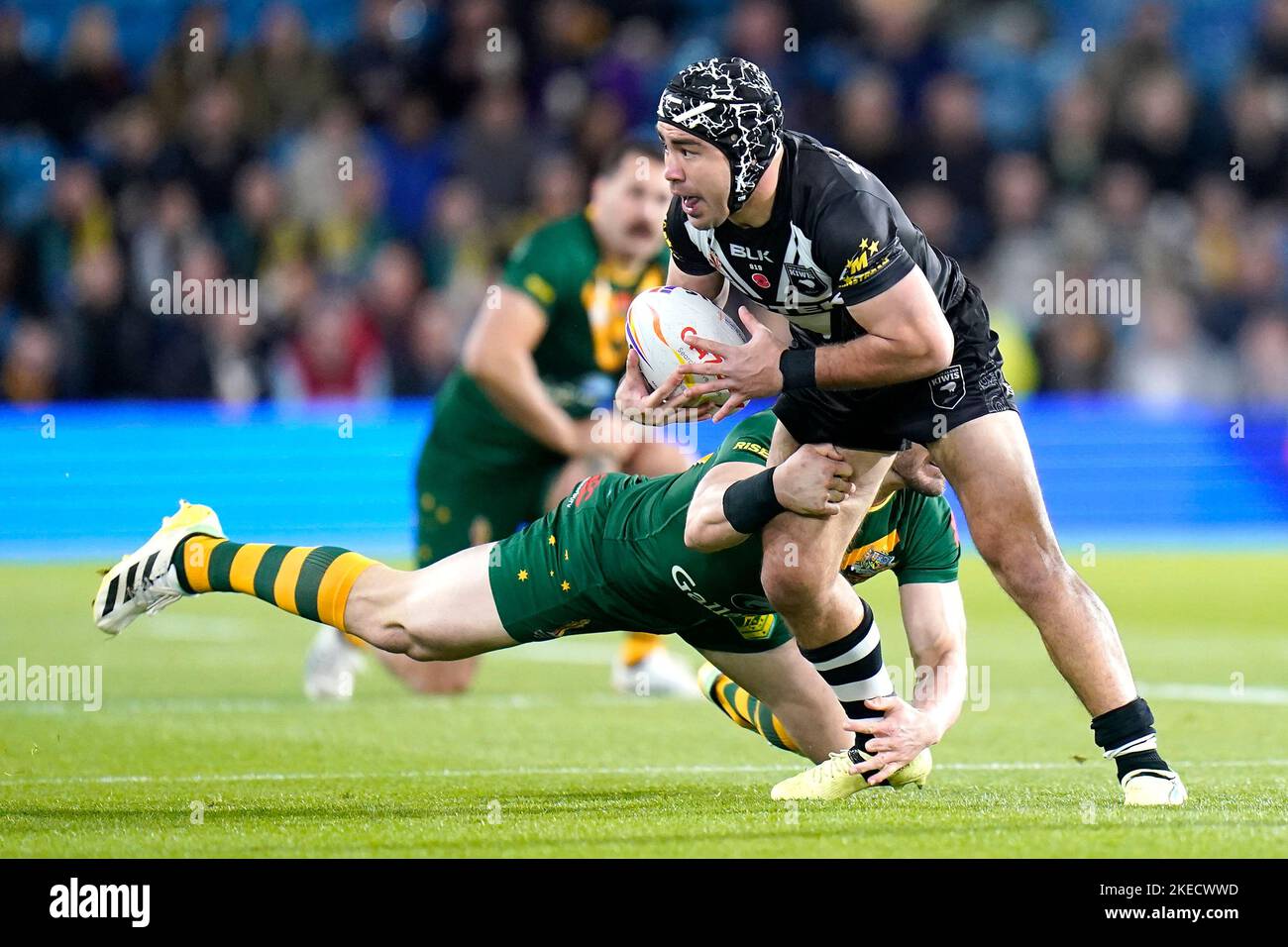 New Zealand's Jahrome Hughes (right) is tackled by Australia's Angus ...