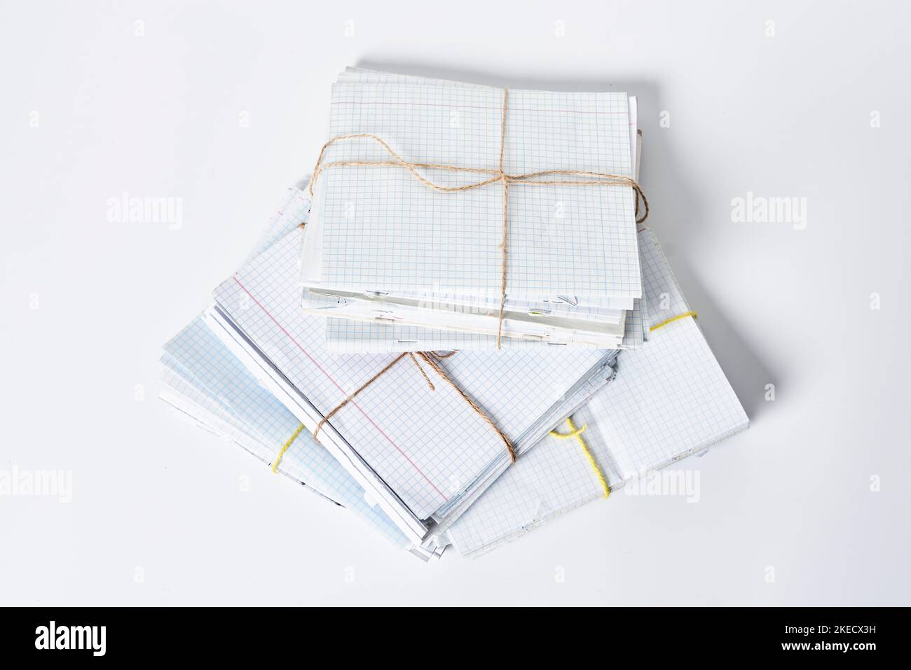 some wrappings on top of each other sheets, tied with string and twined