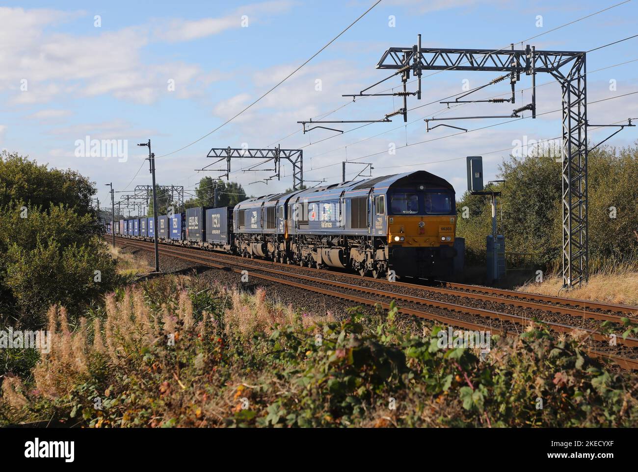 66303 & 66431 pass Hest Bank on 24.9.22 with the Tesco Express. Stock Photo