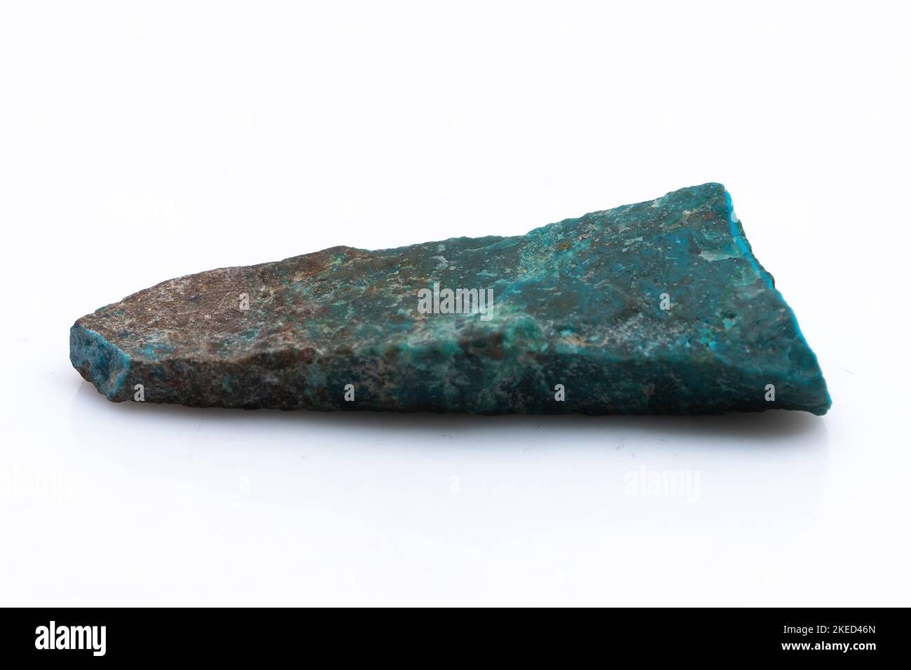 Natural Chrysocolla stone on a white background. Mineral of blue and