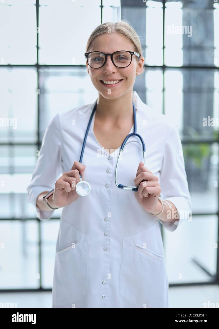 Portrait of a young doctor with glasses in a hospital Stock Photo Alamy