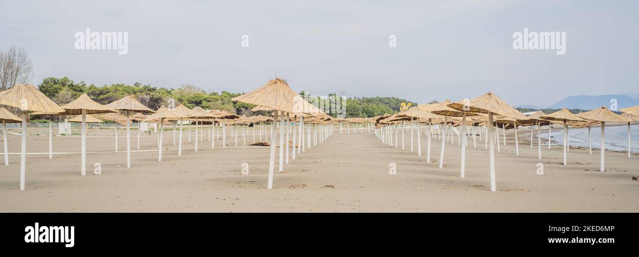 BANNER, LONG FORMAT Sun umbrellas and deckchairs on the Copacabana beach, part of Great Beach Velika Plaza in Ulcinj. Location: Ulcinj, Montenegro Stock Photo