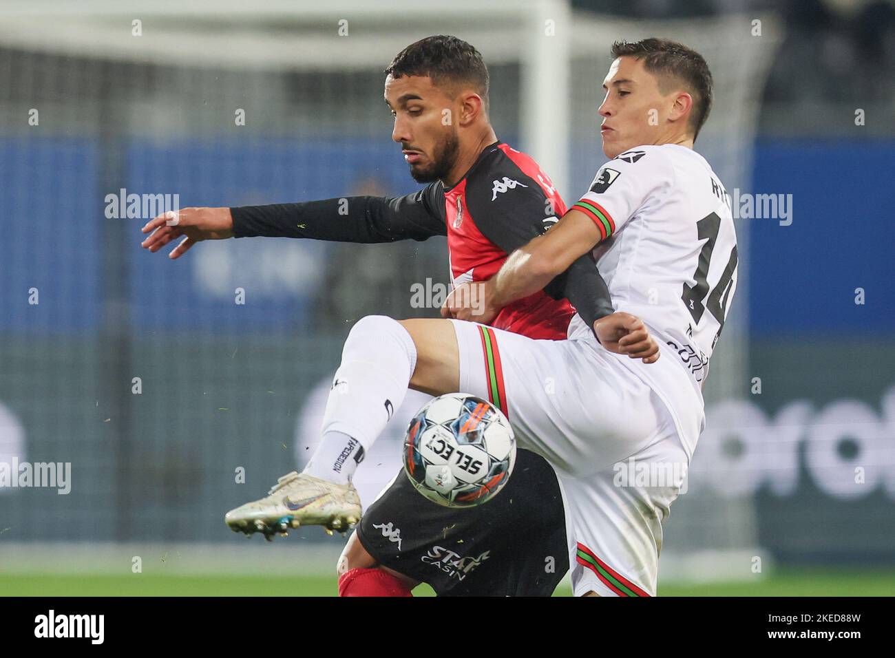 Seraing's Simon Elisor and OHL's Federico Ricca fight for the ball