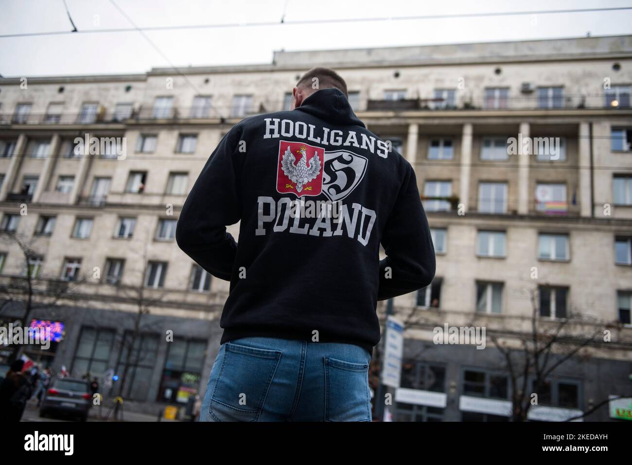 A man wearing a hoodie that says on the back "Hooligans Poland" seen during  the Independence March. Poland's National Independence Day marks the  anniversary of the country's independence in 1918. It is