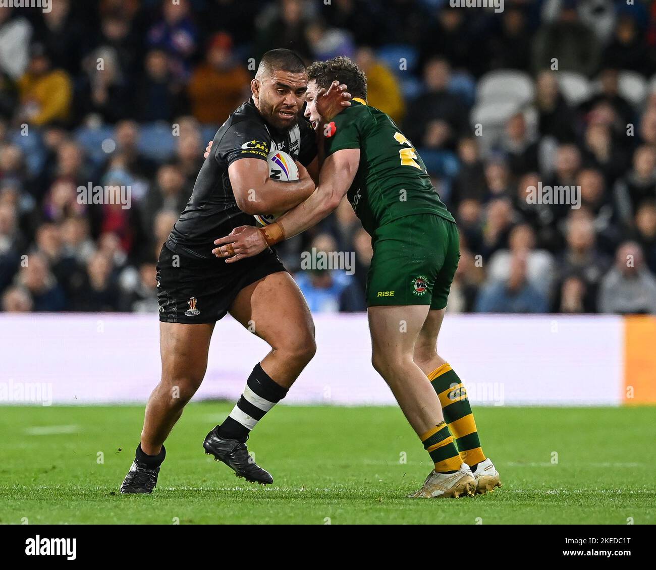 Isaiah Papalii of New Zealand is tackled by Liam Martin of Australia during the Rugby League World Cup 2021 Semi Final match Australia vs New Zealand at Elland Road, Leeds, United Kingdom,