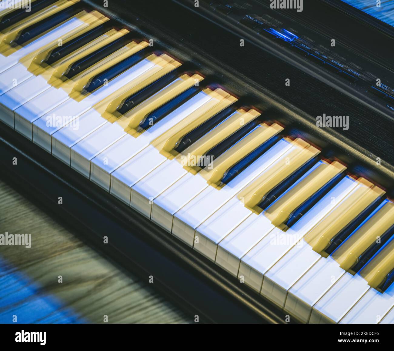 Fragment of a musical instrument. White and black piano keys. Close-up ...