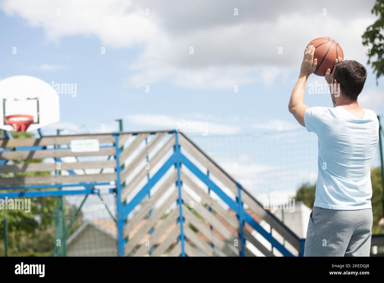 athletic male basketball player in action outdoors Stock Photo